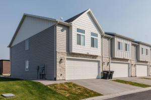 a large house with a garage at Bear Lake Beautiful Brand New End Unit in Garden City