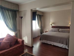 Кровать или кровати в номере Hotel Francisco De Aguirre