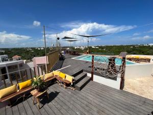 a deck with a swimming pool on a ship at Xkeban Tulum Adults Only in Tulum