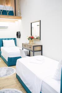 Postel nebo postele na pokoji v ubytování Duplex Rooms