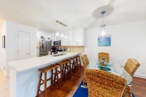 a kitchen and dining room with a table and chairs at A Little Lake Retreat in Branson