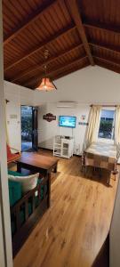 a living room with a couch and a table at Cabañas del Este in Sauce de Portezuelo