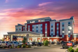 a rendering of a hotel with cars parked in a parking lot at Best Western Premier Executive Residency Medicine Hat in Medicine Hat