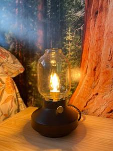 a lantern sitting on a table with a candle in it at NORDIC LAIA 4B - Soldeu - Bordes d'Envalira in Bordes d´Envalira 