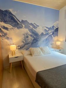 a bedroom with a mountain mural on the wall at NORDIC LAIA 4B - Soldeu - Bordes d'Envalira in Bordes d´Envalira
