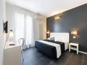 A bed or beds in a room at Residence Giardino