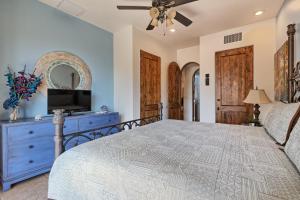 a bedroom with a bed and a tv on a dresser at Bella Sirena Luxury Condo 205-B in Puerto Peñasco +33 photos