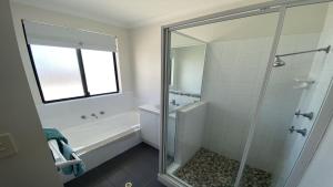 a bathroom with a shower and a bath tub at Adriana Retreat, 20 Adriana Retreat in Jurien Bay +12 photos