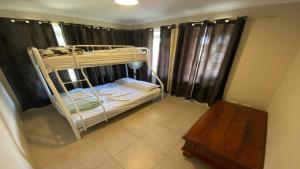 Ένα ή περισσότερα κρεβάτια σε δωμάτιο στο Dalveen Cottage