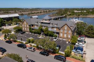 an aerial view of a building with a parking lot at The Tranquil House Inn in Manteo