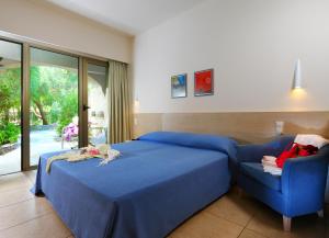 Postel nebo postele na pokoji v ubytování Sitia Beach City Resort & Spa