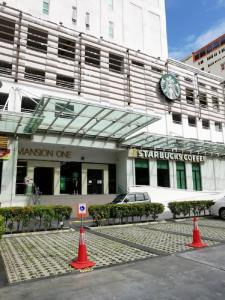 a building with a car parked in front of it at Mansion One by Sky Hive in George Town