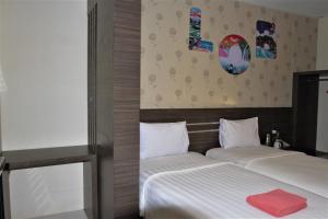 Un ou plusieurs lits dans un hébergement de l'établissement Nutana Hotel Lombok