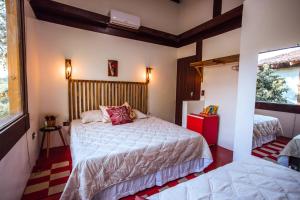 Łóżko lub łóżka w pokoju w obiekcie Pousada Canto da Mata Ilhabela