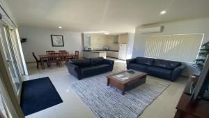 a living room with a couch and a coffee table at Unit 24 Seafront Estate in Jurien Bay