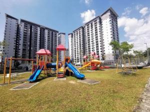 a park with a playground with slides at Homestay Ar Rayyan RESIDENSI LAGUNA BIRU in Rawang
