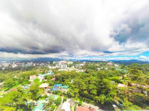 an overhead view of a city with trees and buildings at 456 Hotel in Baguio