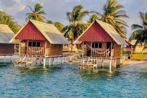a group of houses on a body of water at Private Cabin Over the Water PLUS Meals - San Blas Islands - private bathroom in Panama City