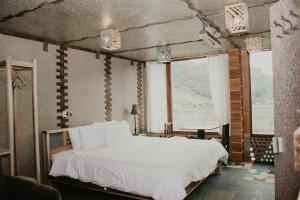 Voodi või voodid majutusasutuse Mamallacta Páramo Lodge toas