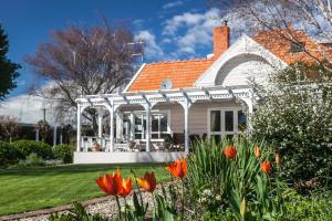 a white house with a gazebo at Anglesea House Inn in Renwick