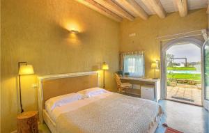 a bedroom with a bed in a room with a window at Beautiful Home In Caltagirone in Caltagirone
