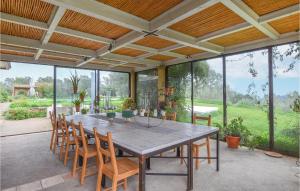 an outdoor dining room with a table and chairs at Beautiful Home In Caltagirone in Caltagirone