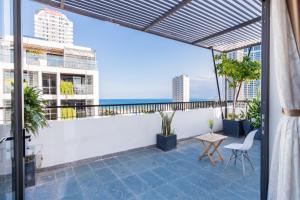 a balcony with a view of the city at Smeraldo Hotel & Apartment in Da Nang