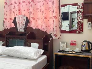 Postel nebo postele na pokoji v ubytování Lotus Blanc Homestay