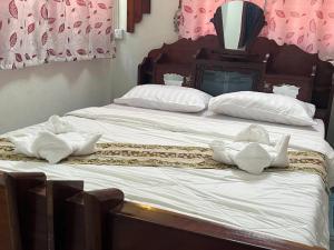 Postel nebo postele na pokoji v ubytování Lotus Blanc Homestay