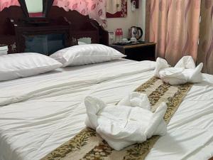 Postel nebo postele na pokoji v ubytování Lotus Blanc Homestay