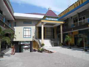 a hotel with a sign that reads ireland at Permata Land Hotel & Resort in Rantauprapat