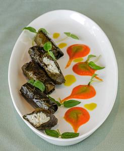 a plate of food with vegetables on a table at The Park Visakhapatnam in Visakhapatnam