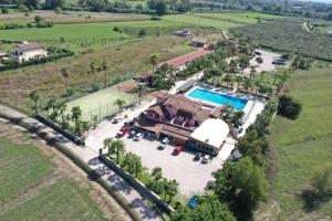 an aerial view of a house with a swimming pool at Oasi del Fauno in Casal Velino