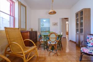 a dining room with chairs and a table in it at Villa Elena in Porto Cesareo +19 photos