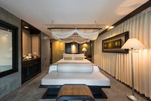 Säng eller sängar i ett rum på The Dewa Koh Chang