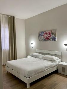 Tempat tidur dalam kamar di Hotel Villa Ruggiero