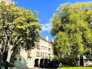 a large building with trees in front of it at Charming Old Town 2 Bed Apt, 2mins from Royal Mile in Edinburgh