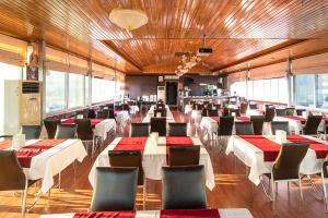 a large room with tables and chairs in it at Pamuk City Hotel in Gaziantep