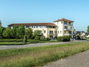a large building on the side of a road at Ostseeresidenz - Whg 11 in Zingst