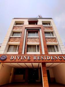 a building with a sign that reads drive residency at Hotel Divine Residency by VARSHRI in Haridwār