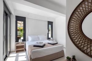 Postel nebo postele na pokoji v ubytování Lindian Palms