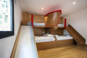 a room with two bunk beds and a ladder at Casa Carmen in Alcanar +34 photos