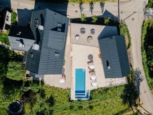 an overhead view of a house with a swimming pool at Villa Flora - a scene for all seasons in Bad Goisern