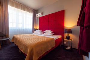 Postel nebo postele na pokoji v ubytování Centrum Hotel Viljandi