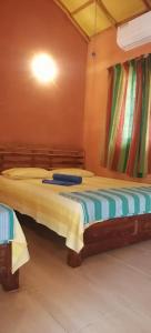 a bedroom with two beds in a room at කැලෑව Kelewa Eco Resort in Anuradhapura