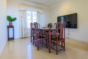 a dining room with a table and chairs at Beautiful Home with Breath-taking Views Mt Tamborine in Eagle Heights