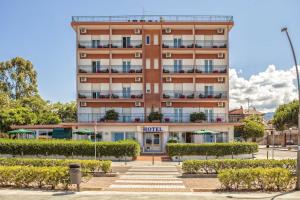 a hotel building with stairs in front of it at Hotel Murano in Rossano