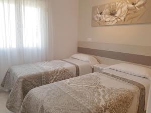 Łóżko lub łóżka w pokoju w obiekcie Firstline apartment RUBINO Arenal-Bol Calpe