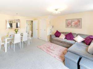a living room with a couch and a table at Pass the Keys Stylish modern two bedroom home in Shrewsbury in Shrewsbury