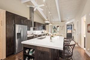 a kitchen with a white counter and a refrigerator at Standard 2 Bedroom - Aspen Alps #110 in Aspen